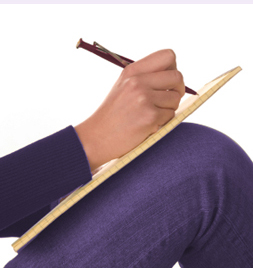 An image of a writer writing on her knee (it isn�t me)